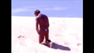 Tanned guy on beach in tiny string thong (temporarily!)