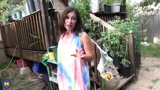 Mature Samy Rodriguez is getting wet in her garden