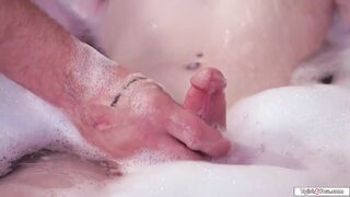 Big tits shemale Izzy Wilde handjobbed and sucked in the tub